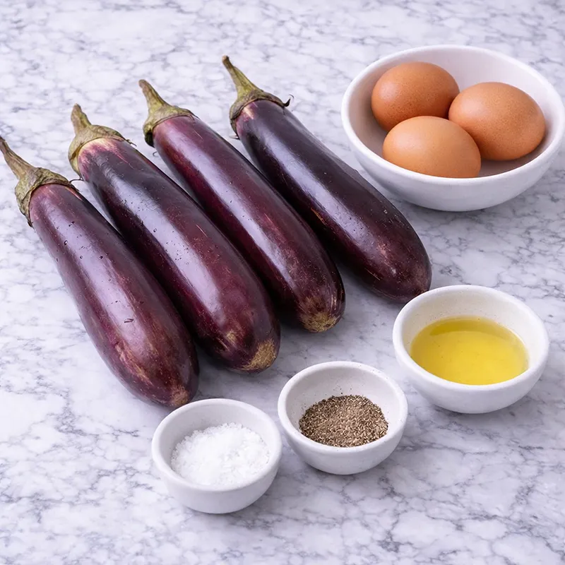 tortang talong ingredients laid out on a marble counter